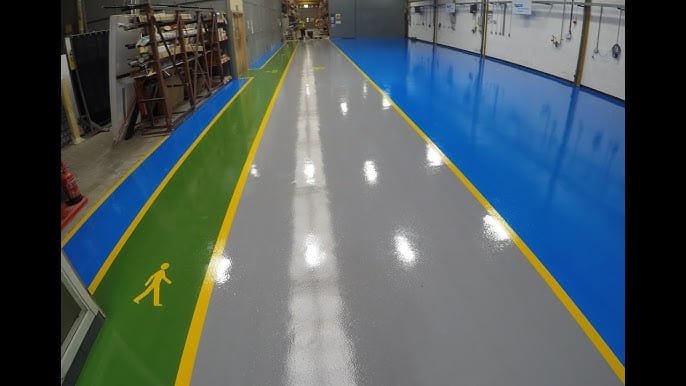 Can Epoxy Handle Heavy Equipment and Forklifts? | QLD Industrial Flooring Guide 2 Heavy duty warehouse epoxy flooring with forklift traffic