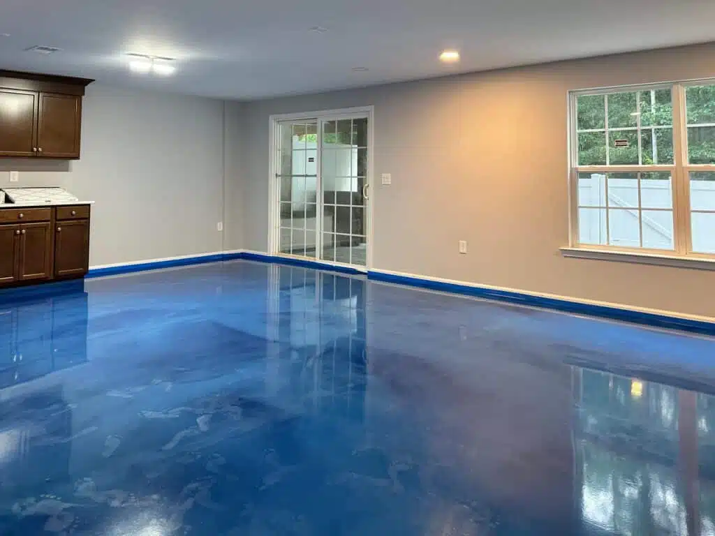 High-gloss blue metallic epoxy flooring for residential spaces by Resin Masters